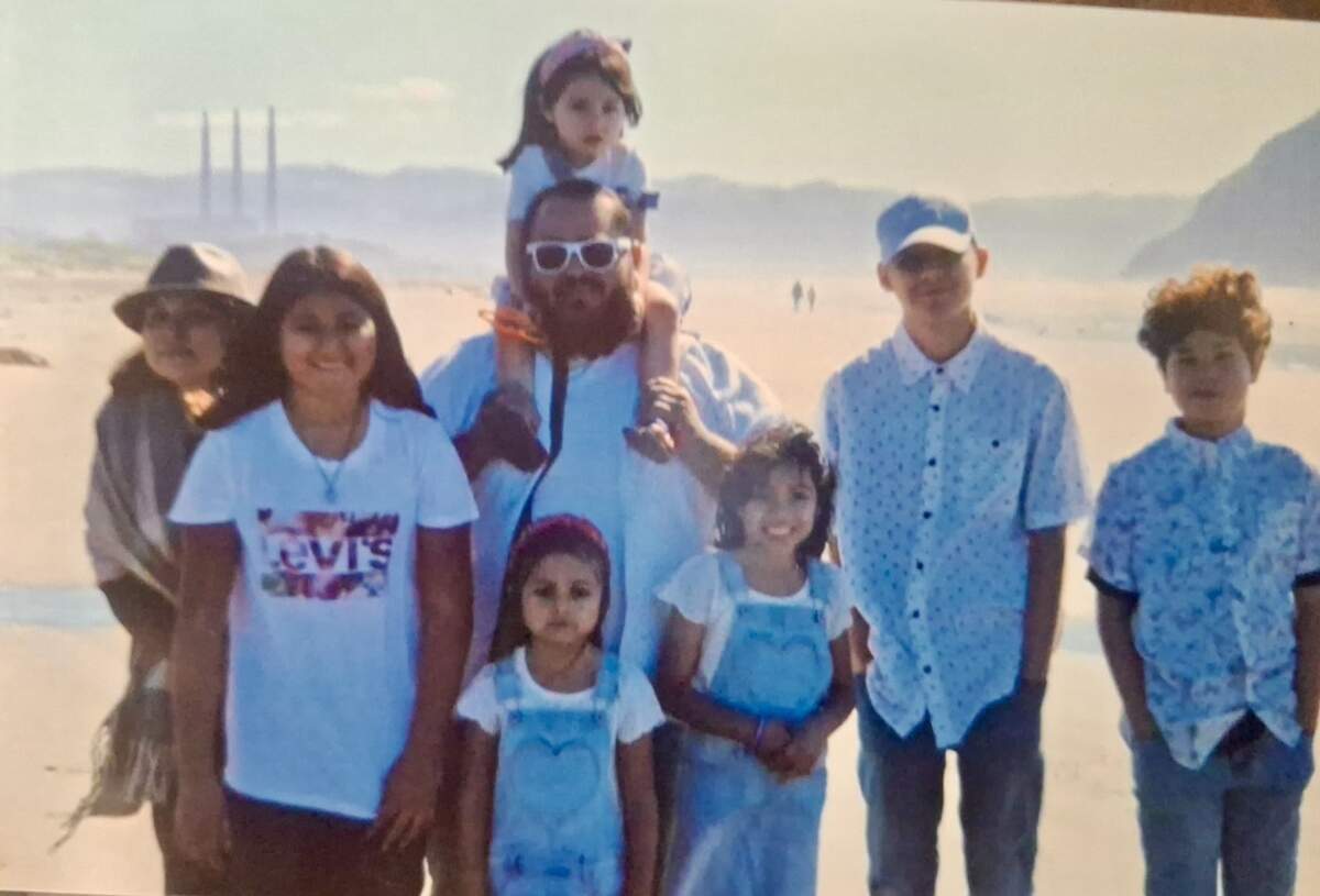 Michael Alexander Diaz and family. From left to right, Rosa Diaz, Julissa, Elvia (on shoulders), Sariah, Armani, Adrian and Jayden.
